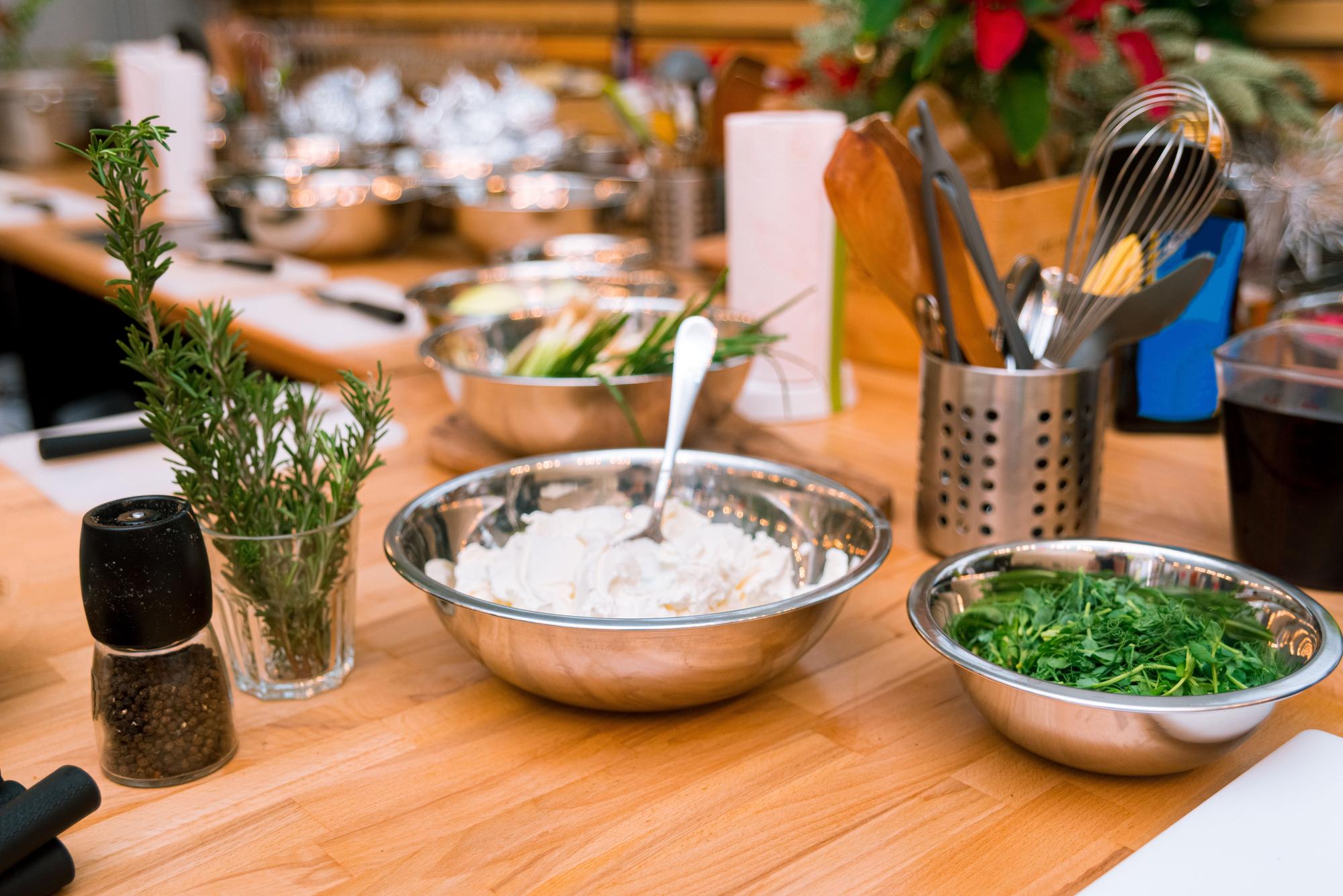 Open kitchen workspace with plated meals and tools