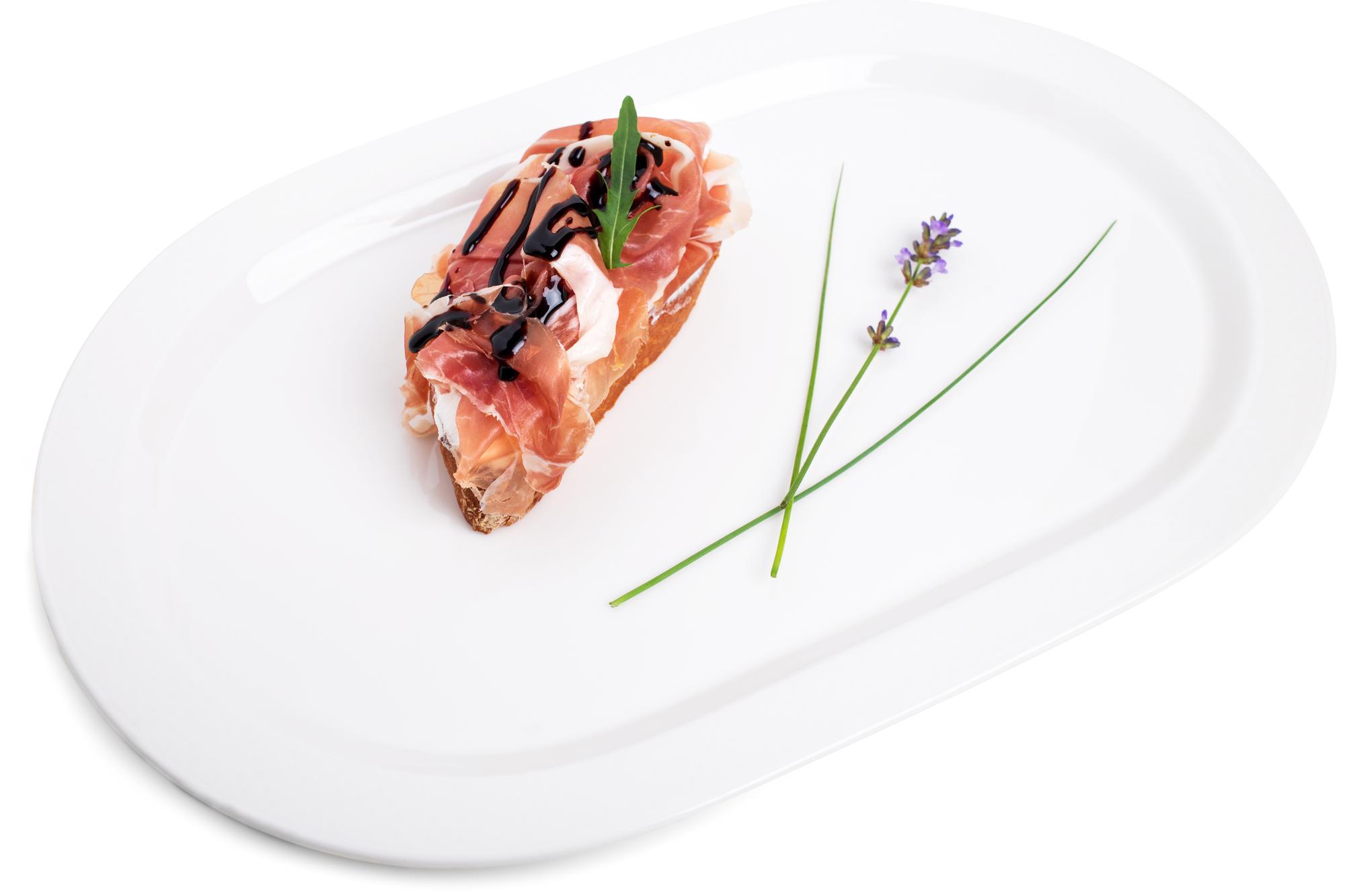 Minimal plated seafood with garnish