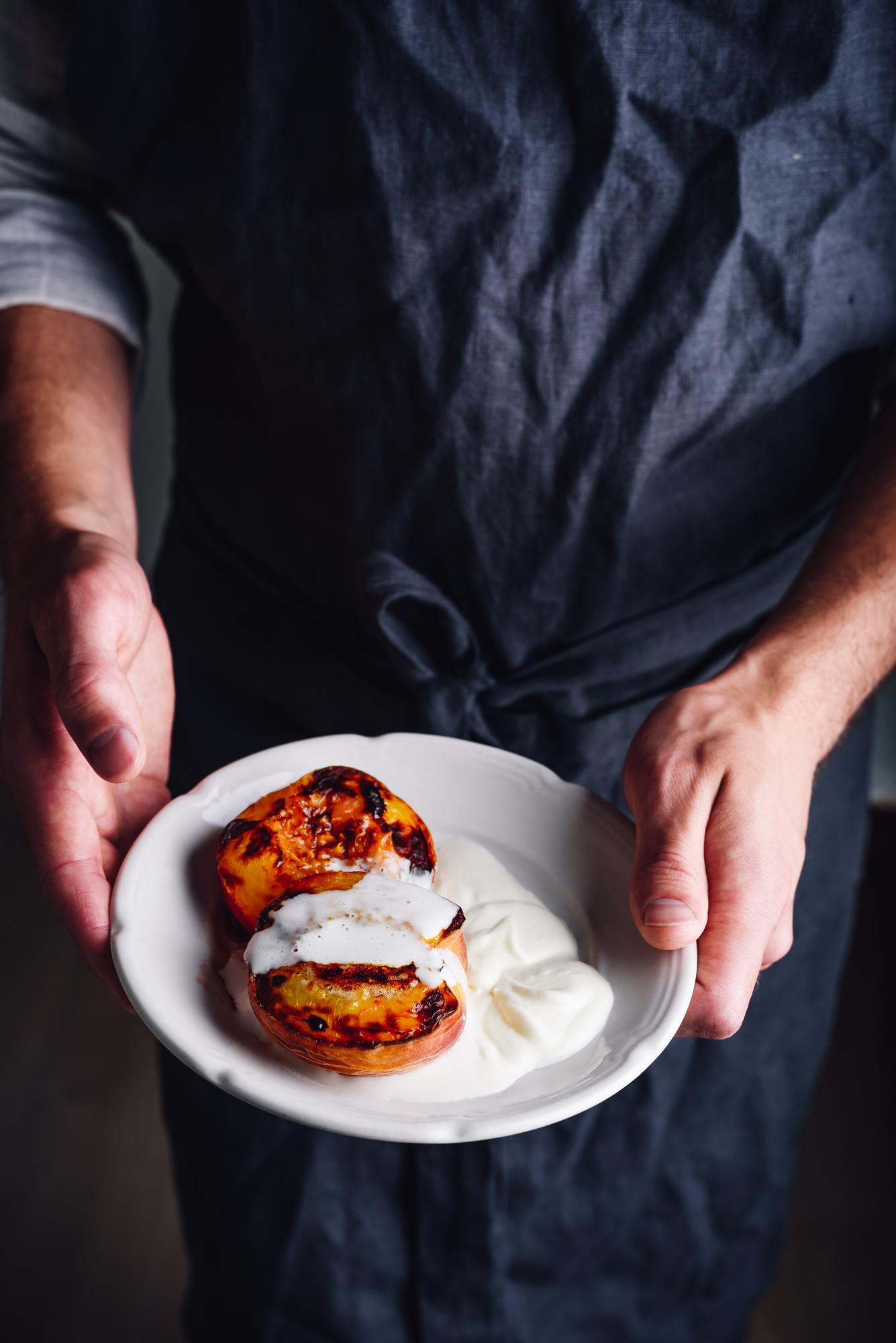 Chef hands arranging dessert